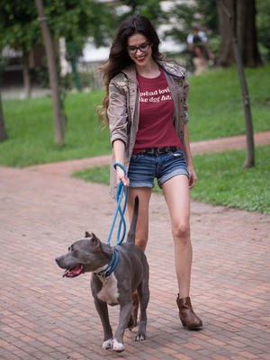 A full-body shot of a model wearing the shirt, smiling and spreading love like dog hair